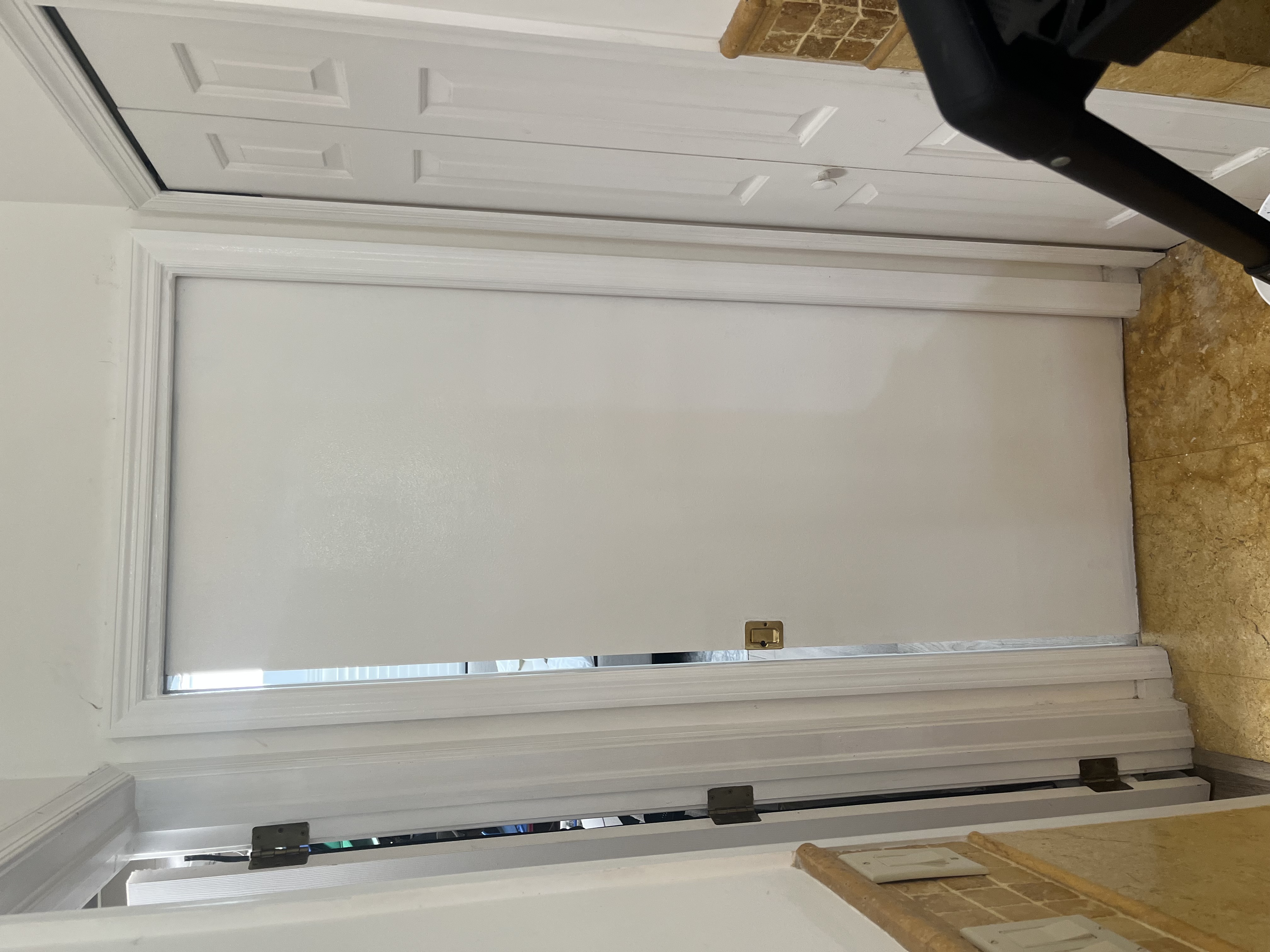 Pocket door after the rolling brackets were replaced and the casing was reinstalled and painted