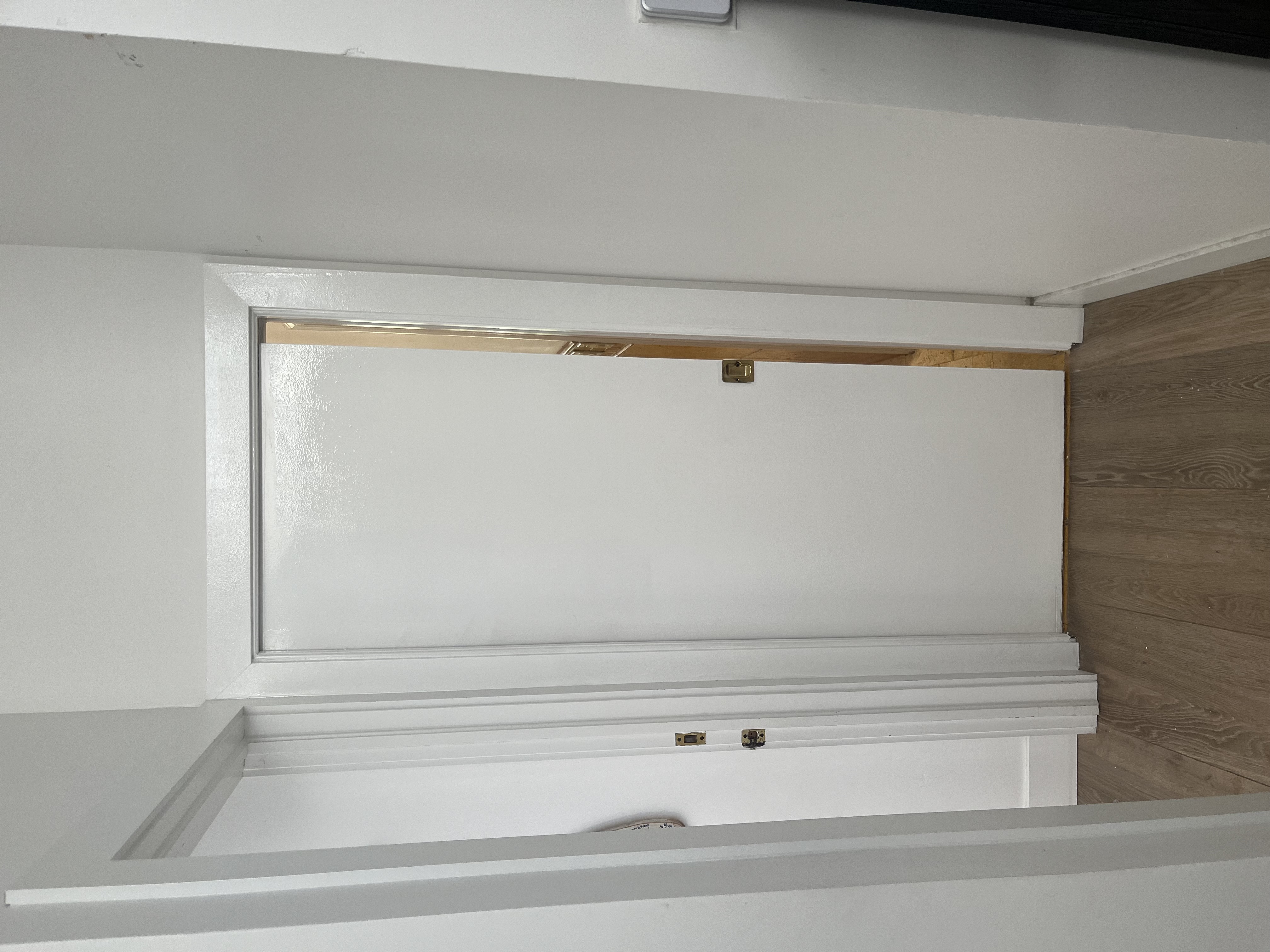 Finished pocket door and casing after repair and fresh white paint