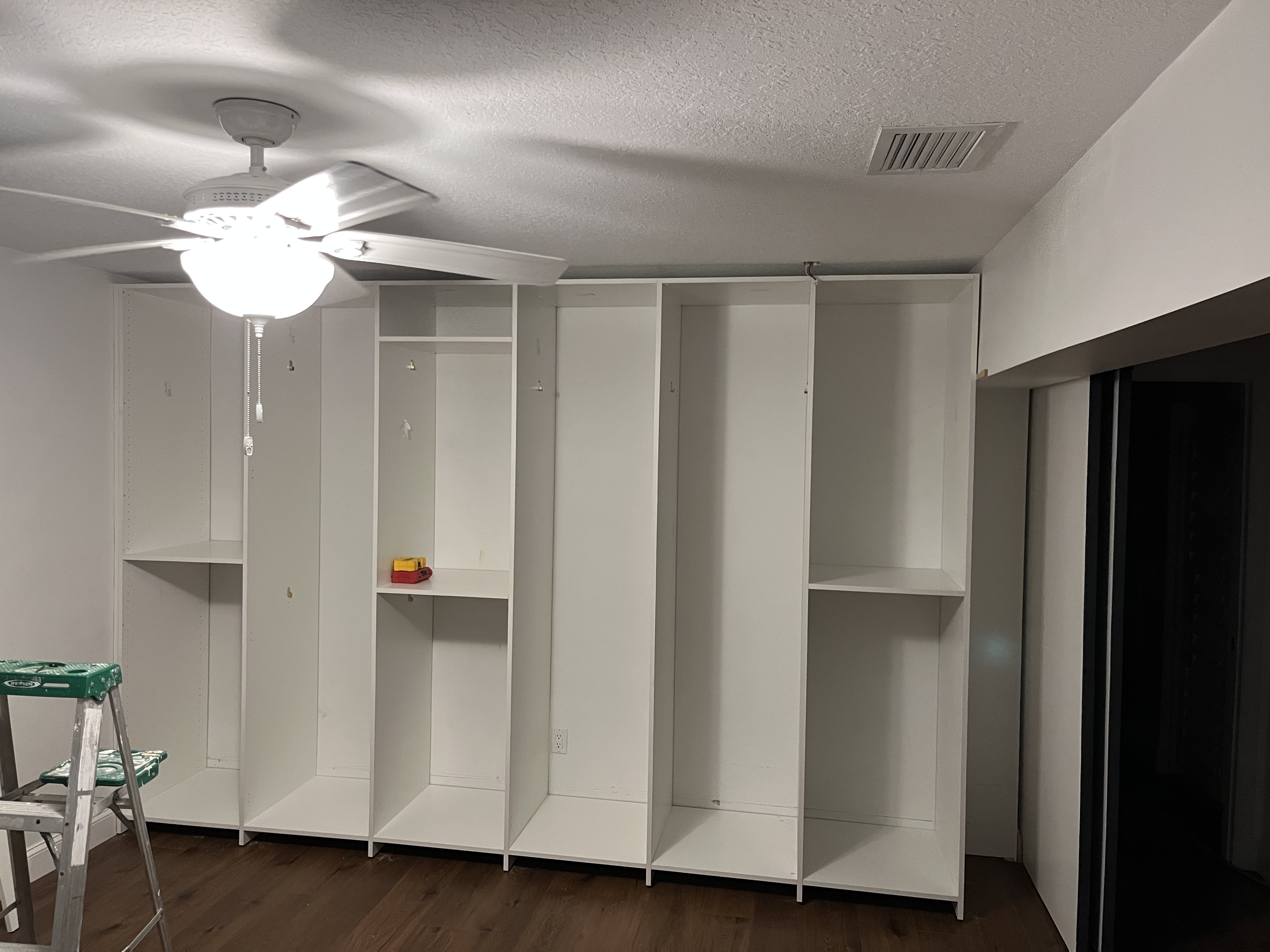 Closet project mid-installation with vertical sections assembled