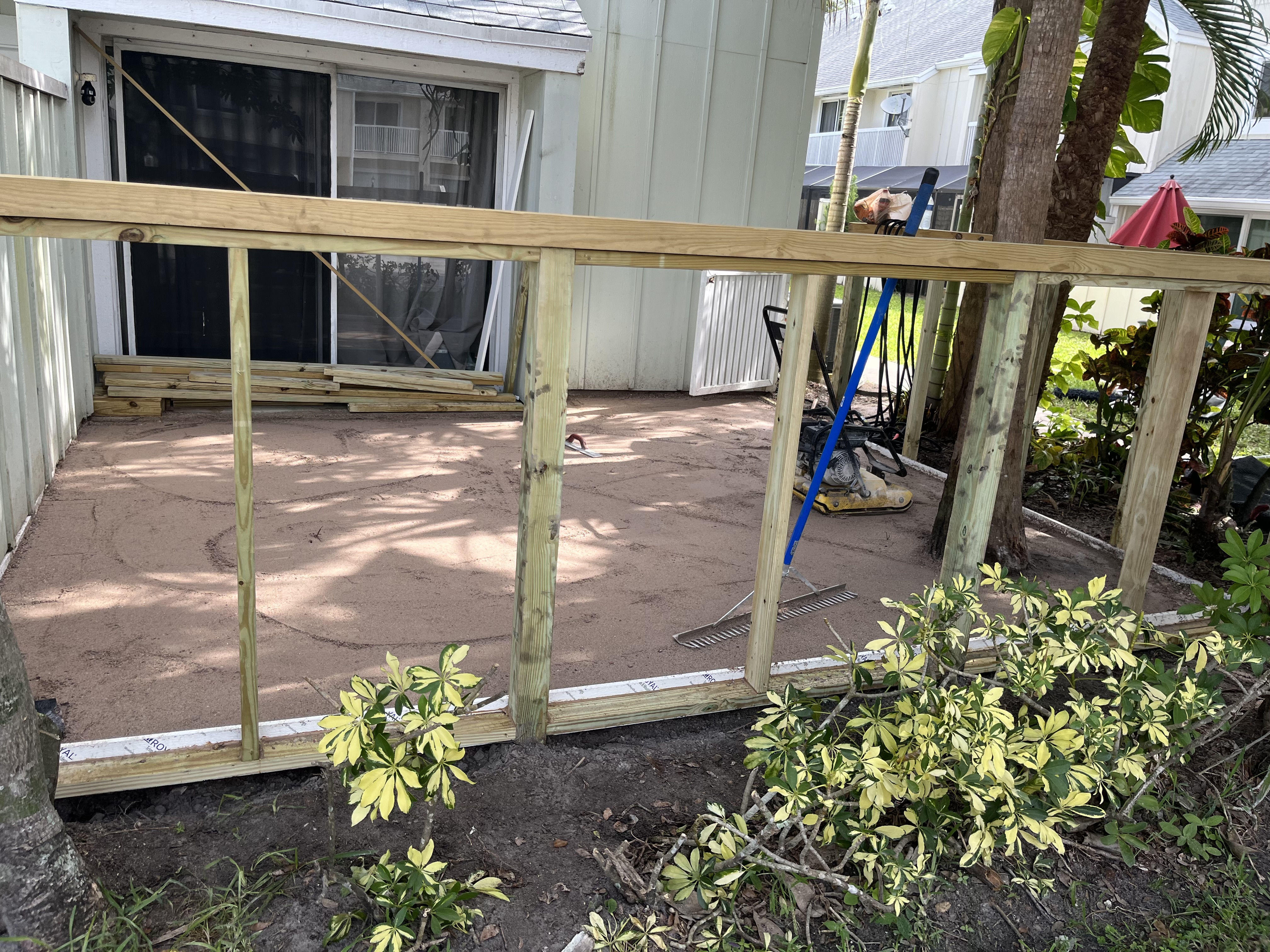 New fence framing installed around the backyard while the base was being prepared for turf