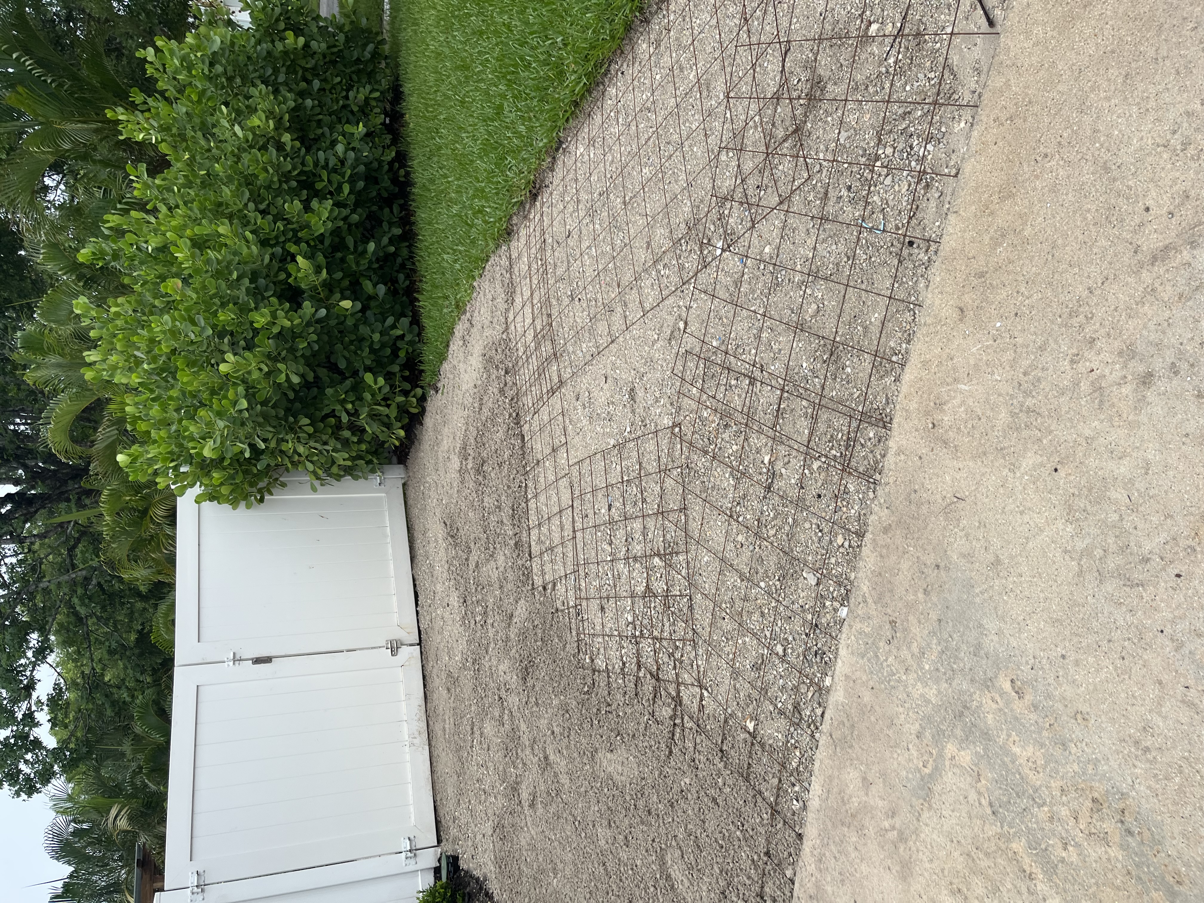 Reinforcement grid laid across the prepared base before the concrete pour