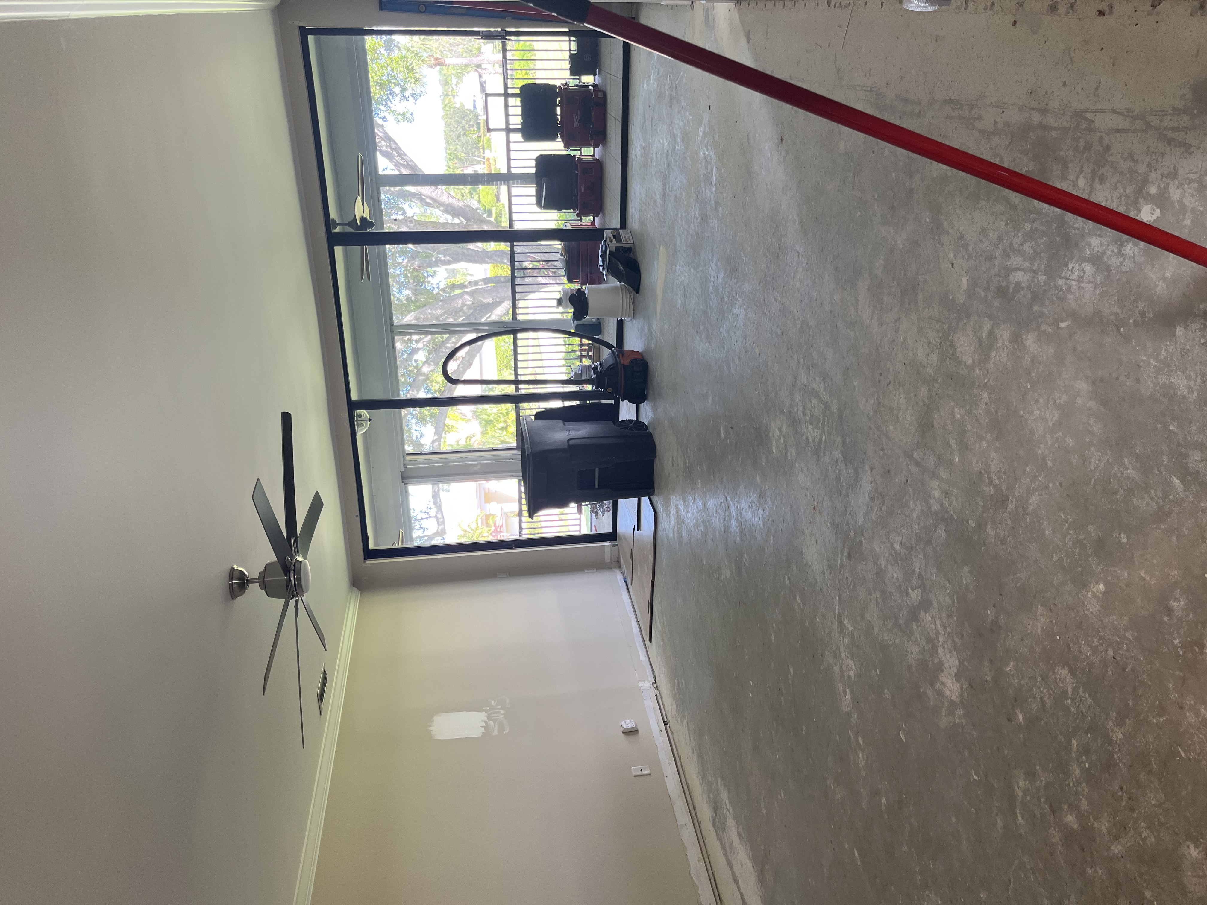 Flooring materials laid out to begin a herringbone wood floor installation